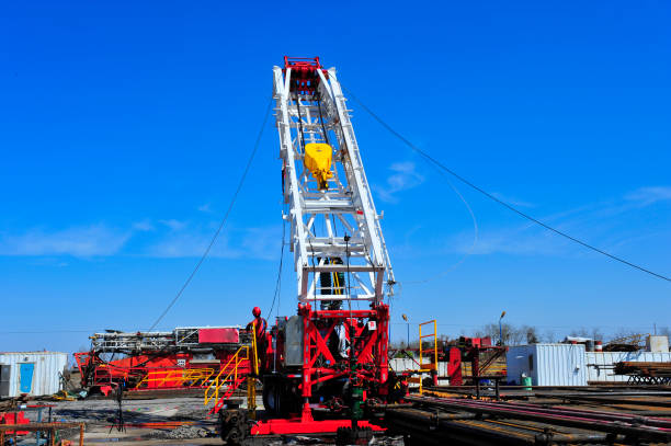 istock Oil field oil workers at work 948859330