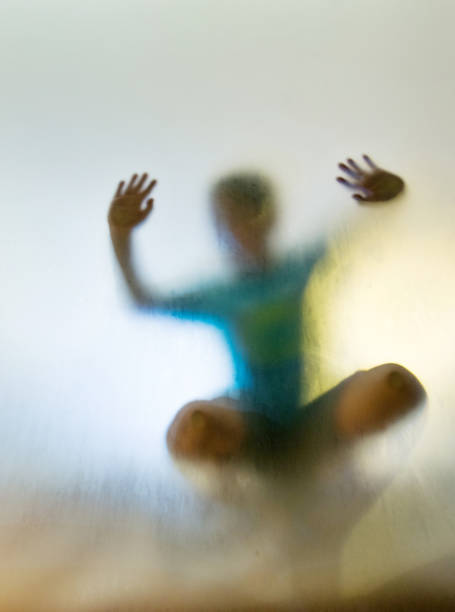 istock A child is trapping in frosted glass 948861280