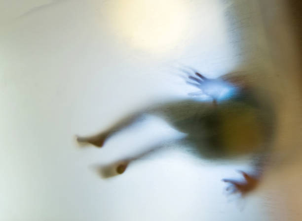 A child is trapping in frosted glass