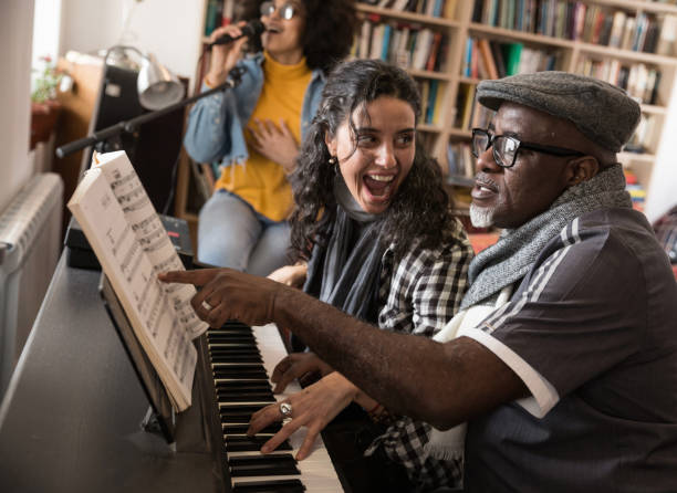 istock Music Teacher Having Lesson At Piano 948863626