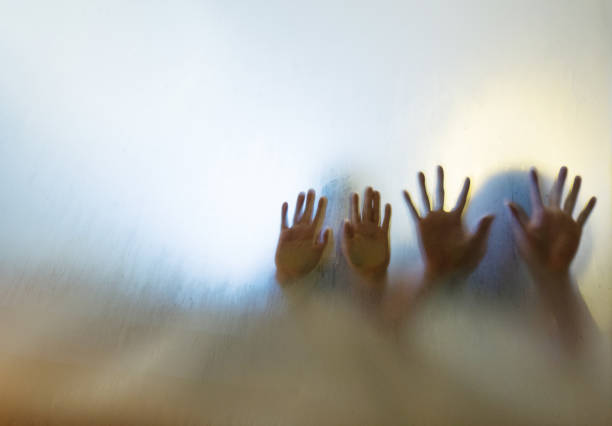 istock Man hands touching frosted glass 948865258