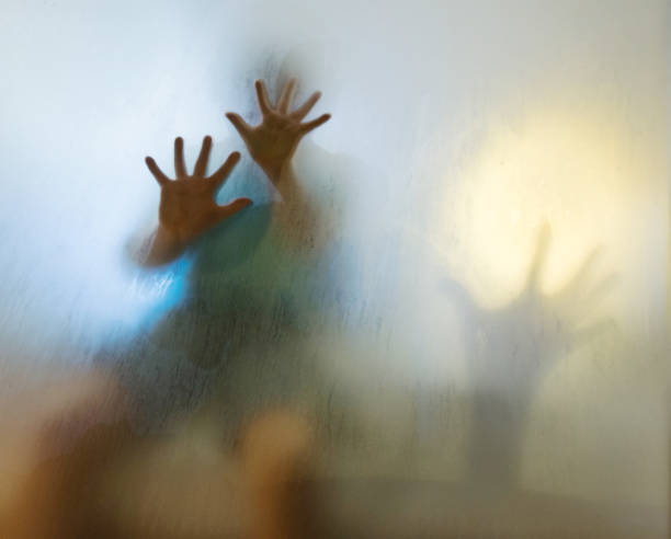 istock Man hands touching frosted glass 948865422