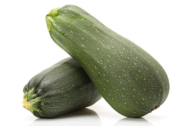 istock Two fresh zucchini insulatio on a white background 948868184