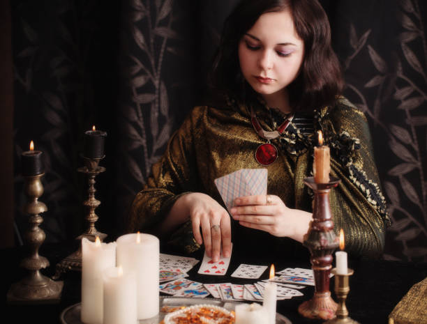 istock Young woman with divination cards in room 948874636