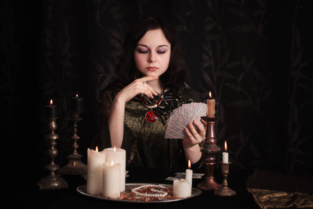 istock Young woman with divination cards in room 948874676