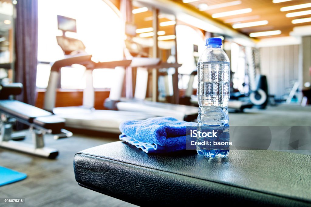 Towel and a bottle of water in gym Gym Stock Photo