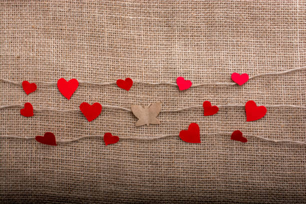 istock Love concept with heart shaped icons  on threads and butterfly 948876122