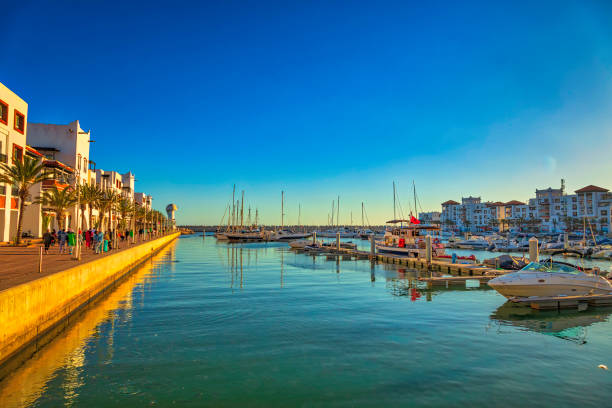 marina of Agadir view of the Agadir marina full of tourists, boats and yachts at sunset morocco landscape stock pictures, royalty-free photos & images