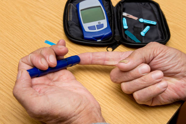 istock Concept diabetes in the elderly retired. Senior man with glucometer checking blood sugar level at home. Learn to use a glucometer 948881744
