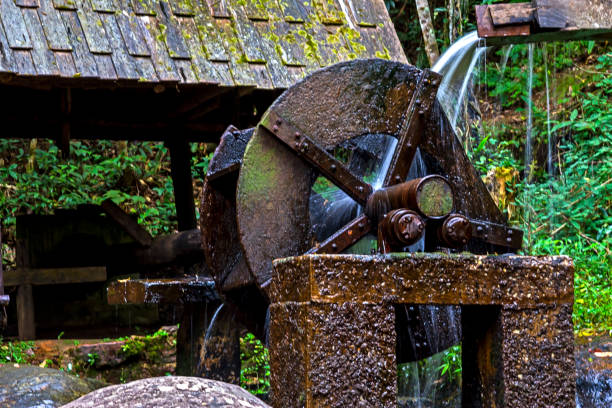 istock Waterfall and old water turbine 948882284