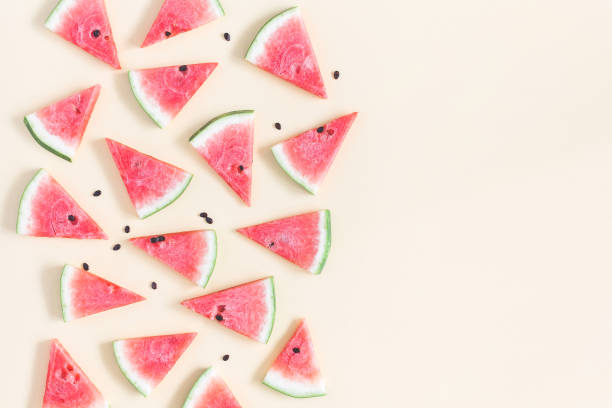 istock Red watermelon on yellow background. Flat lay, top view 948882732