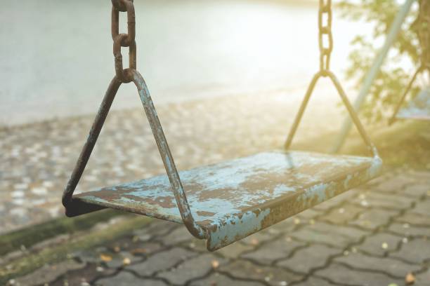 istock Old Metal Swing in Park. 948883200