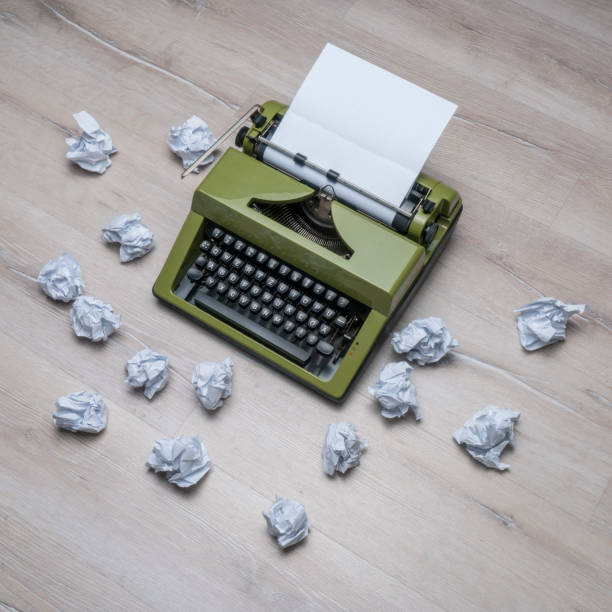 istock Vintage Typewriter and crumpled papers 948884376
