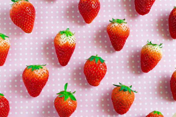 istock Fresh strawberry and pink dot background 948887726