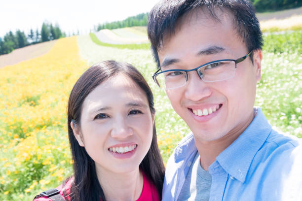 istock couple with landscape in Furano 948887746