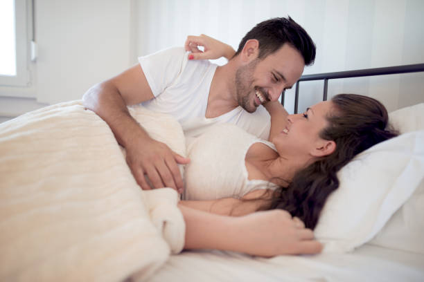istock Charming couple in their bedroom 948887790