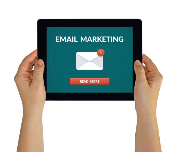 istock Hands holding tablet with email marketing concept on screen 948898320