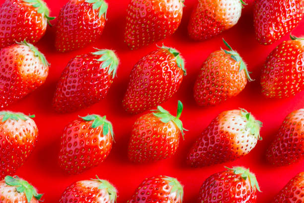 istock Fresh strawberry and pink dot background 948898436