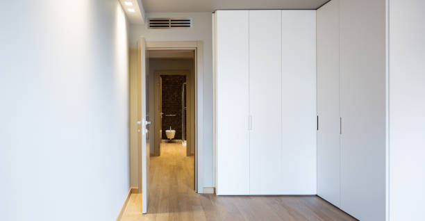 istock Front view of modern room with large wardrobe 948899970