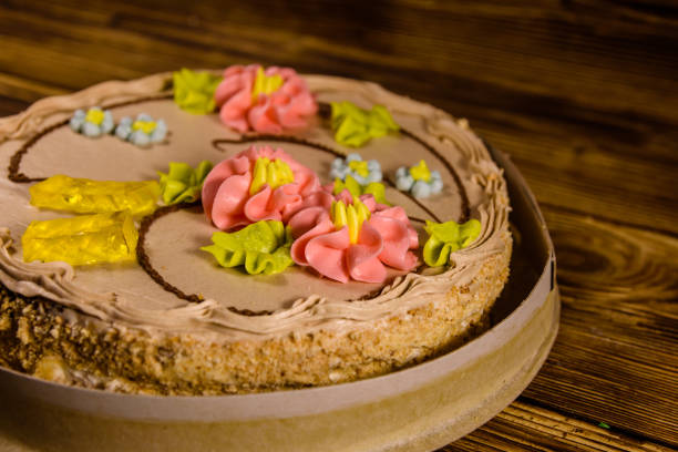 istock Kiev cake with cream on wooden table 948900182
