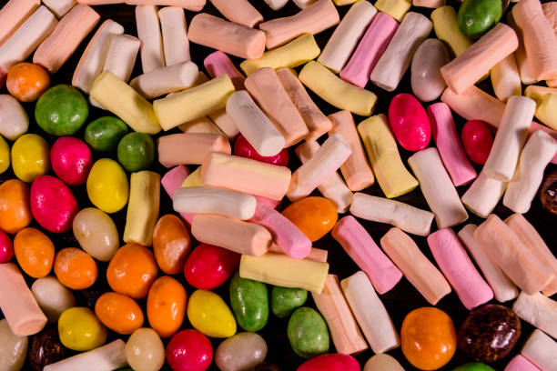 istock Background of the different multi colored candies. Festive concept 948900492