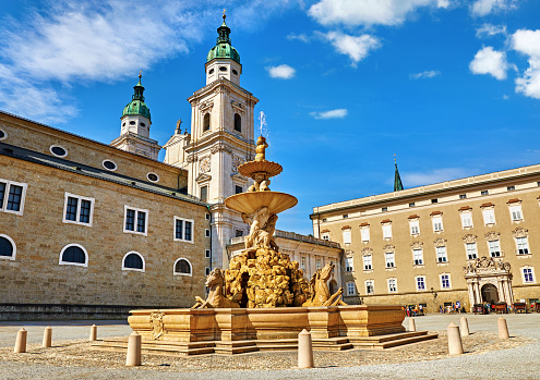 Salzburg, Austria. Fountain at central Residenzplatz with cathedral and town hall in old town. Famous austrial landmark.