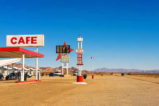Amboy, California, USA - December 27, 2017 : Roy's motel and cafe with vintage neon sign on historic Route 66 in the Mojave desert.