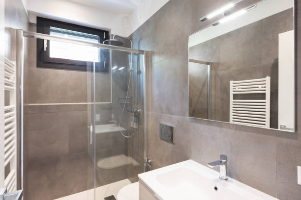istock Minimalist modern bathroom with large tiles 948915330