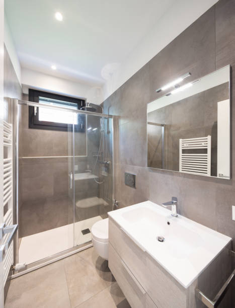 istock Minimalist modern bathroom with large tiles 948915586