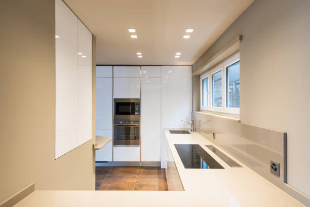 istock Kitchen with modern white furniture and latest generation appliances 948915956