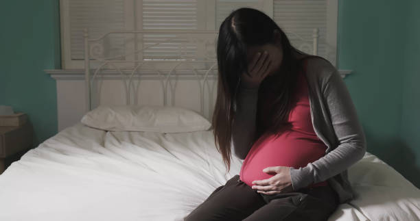pregnant women feel depression stock photo