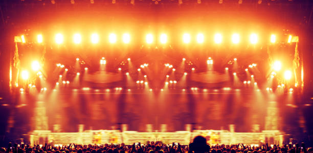 istock Concert arena with fans clapping 948930928