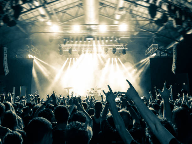 istock Concert arena with fans clapping 948930942