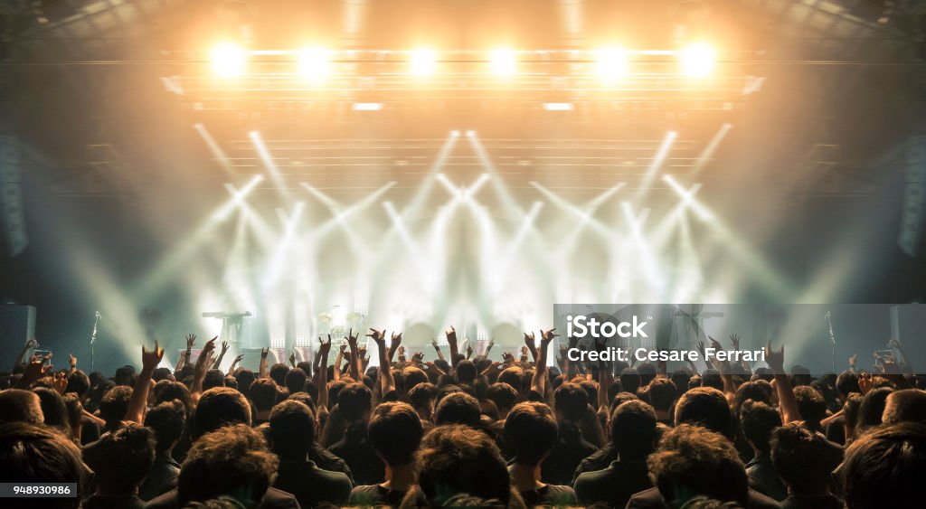 Concert arena with fans clapping Concert wide arena with happy fans clapping. Performance Stock Photo