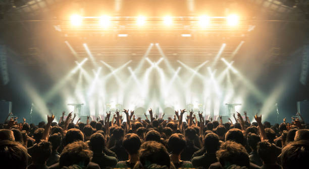 Concert arena with fans clapping Concert wide arena with happy fans clapping. musical on stage stock pictures, royalty-free photos & images