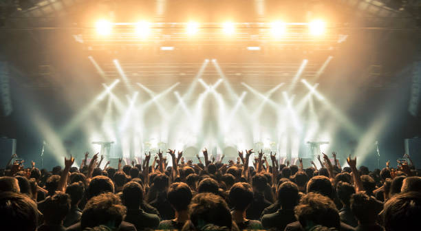 Concert arena with fans clapping Concert wide arena with happy fans clapping. Performance stock pictures, royalty-free photos & images