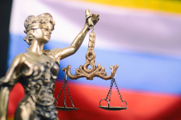 Scales of Justice, Justitia, Lady Justice in front of the Russian flag in the background. Law and Justice, Legality concept, Scales of Justice, Justitia, Lady Justice in front of the Russian flag in the background. classical god stock pictures, royalty-free photos & images