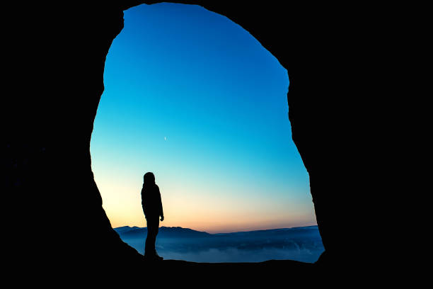 istock Female traveler in mountains at night 948948606