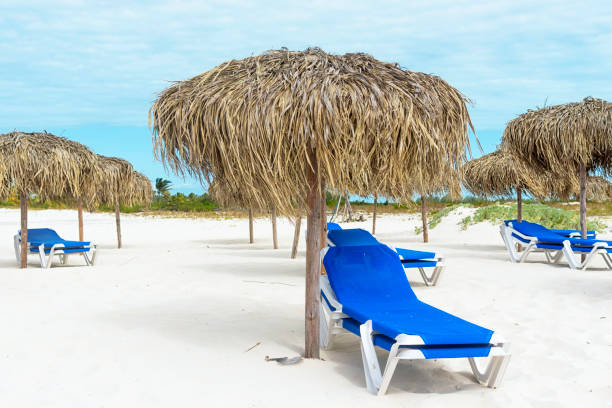 istock Empty beach in low season, sun loungers and umbrellas 948948830