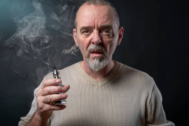 istock portrait of a man with beard who is vaping 948962482