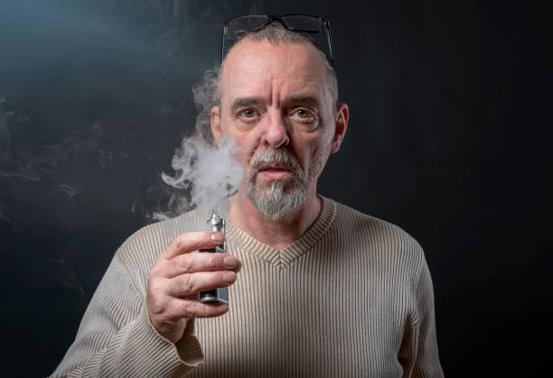istock portrait of a man with beard who is vaping 948962600