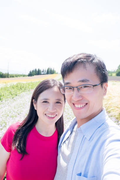 istock couple with landscape in Furano 948974336