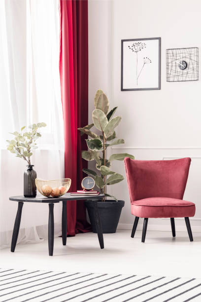 istock Coffee table, plant and armchair 948978088