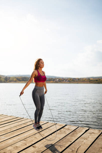 istock Fit young woman skipping a rope 948978178