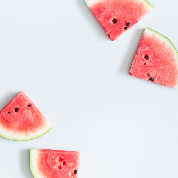 istock Red watermelon on blue background. Flat lay, top view 948985996