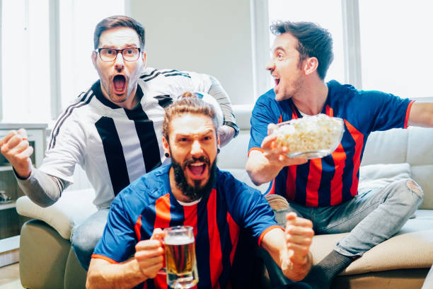 istock Excited soccer supporters screaming 948987334