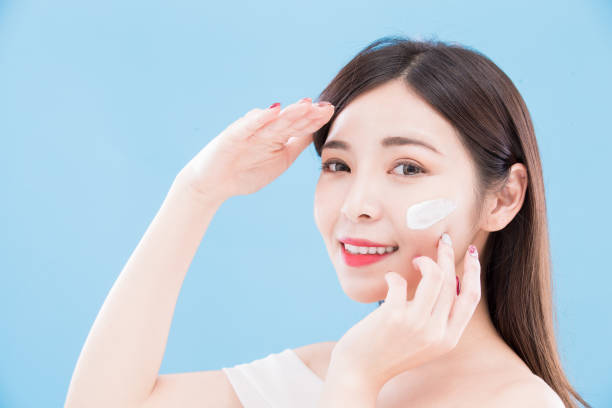 istock woman use sun cream 948987444