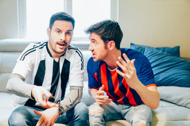 Angry football supporters discussing game
