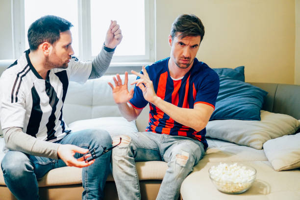 istock Angry men fighting over football 948989990