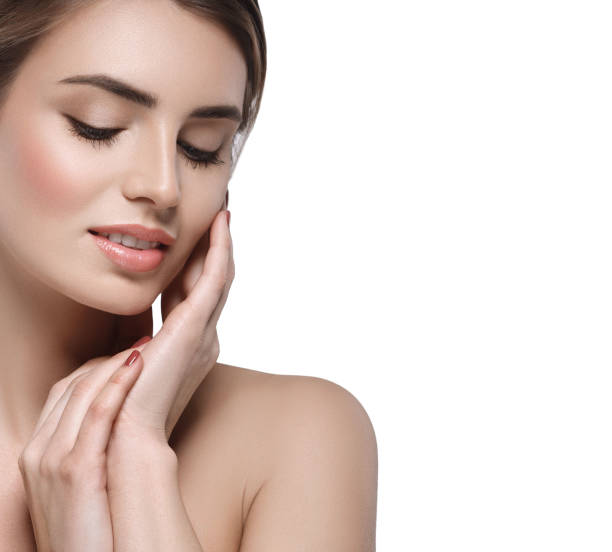 istock Beautiful woman face close up studio on white 948992078
